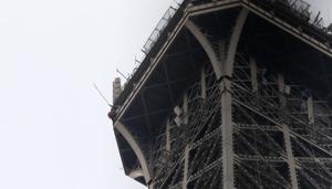 A rescue worker, left in red, climbs the Eiffel Tower Monday, May 20, 2019 in Paris. The Eiffel Tower has been closed to visitors after a person has tried to scale it. (AP Photo/Michel Euler)(AP) A rescue worker, left in red, climbs the Eiffel Tower Monday, May 20, 2019 in Paris. The Eiffel Tower has been closed to visitors after a person has tried to scale it. (AP Photo/Michel Euler)(AP)