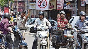 A police officer turns back vehicles on the wrong side of Padam Singh Road, on which one way traffic was allowed on trial basis from today at Karol Bagh in New Delhi(Sanchit Khanna / Hindustan Times) A police officer turns back vehicles on the wrong side of Padam Singh Road, on which one way traffic was allowed on trial basis from today at Karol Bagh in New Delhi(Sanchit Khanna / Hindustan Times)
