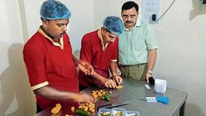 Sweets being prepared in the shape of the BJP symbol.