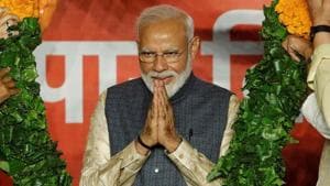 Prime Minister Narendra Modi gestures as he is presented with a garland by Bharatiya Janata Party (BJP) leaders after the election results in New Delhi, India, May 23, 2019.(REUTERS FILE PHOTO) Prime Minister Narendra Modi gestures as he is presented with a garland by Bharatiya Janata Party (BJP) leaders after the election results in New Delhi, India, May 23, 2019.(REUTERS FILE PHOTO)