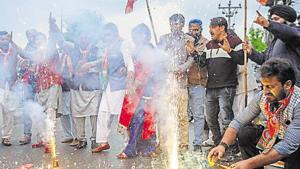 BJP workers burst crackers and dance while celebrating the party's win in the 2019 Lok Sabha elections in Srinagar on Thursday.(ANI PHOTO) BJP workers burst crackers and dance while celebrating the party's win in the 2019 Lok Sabha elections in Srinagar on Thursday.(ANI PHOTO)