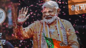 A poster of Indian Prime Minister Narendra Modi in Mumbai as BJP supporters celebrate on the election results day outside the BJP headquarters in Mumbai on May 23, 2019.(AFP) A poster of Indian Prime Minister Narendra Modi in Mumbai as BJP supporters celebrate on the election results day outside the BJP headquarters in Mumbai on May 23, 2019.(AFP)