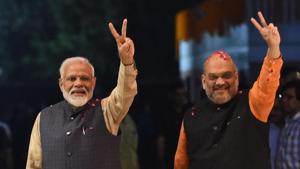 Indian Prime Minister Narendra Modi (L) and president of the ruling Bharatiya Janata Party (BJP) Amit Shah gesture as they celebrate the victory in India's general elections(AFP)