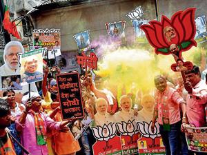 BJP workers celebrating the party's victory in Lok Sabha elections, in Varanasi on Thursday.(Rajesh Kumar/HT) BJP workers celebrating the party's victory in Lok Sabha elections, in Varanasi on Thursday.(Rajesh Kumar/HT)