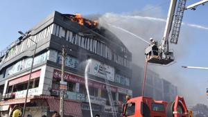 Surat, India-May 24, 2019: Firefighters douse a fire in Takshila complex after a fire engulfed the third and fourth floor of the coaching centre, in Surat (HT Photo) Surat, India-May 24, 2019: Firefighters douse a fire in Takshila complex after a fire engulfed the third and fourth floor of the coaching centre, in Surat (HT Photo)