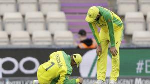 Australia's Usman Khawaja, left, lies down with an injury he picked up fielding before he was helped to limp off the field of play during the Cricket World Cup warm-up match between Australia and Sri Lanka at the Hampshire Bowl in Southampton, England, Monday, May 27, 2019. (AP Photo/Matt Dunham)(AP) Australia's Usman Khawaja, left, lies down with an injury he picked up fielding before he was helped to limp off the field of play during the Cricket World Cup warm-up match between Australia and Sri Lanka at the Hampshire Bowl in Southampton, England, Monday, May 27, 2019. (AP Photo/Matt Dunham)(AP)