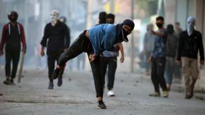 A man throws stones during protests against the killing of militant commander Zakir Musa in Srinagar May 25, 2019.(REUTERS) A man throws stones during protests against the killing of militant commander Zakir Musa in Srinagar May 25, 2019.(REUTERS)