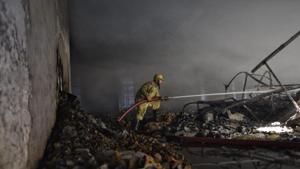Fire fighters dozing off the fire in a headlight making factory for motor vehicles in Udyog Nagar near Peeragarhi, New Delhi.(Sanchit Khanna/HT Photo) Fire fighters dozing off the fire in a headlight making factory for motor vehicles in Udyog Nagar near Peeragarhi, New Delhi.(Sanchit Khanna/HT Photo)