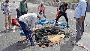 Workers repair a portion of the Hero Honda Chowk flyover that was damaged on May 8 for the second time in a year.(HT File Photo) Workers repair a portion of the Hero Honda Chowk flyover that was damaged on May 8 for the second time in a year.(HT File Photo)