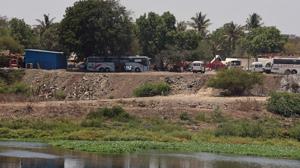 On Wednesday, Hindustan Times published a report about a large portion of Mula riverside land encroached by dumping debris(Pratham Gokhale/HT Photo) On Wednesday, Hindustan Times published a report about a large portion of Mula riverside land encroached by dumping debris(Pratham Gokhale/HT Photo)