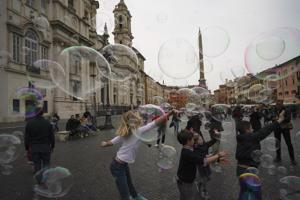Children play with soap bubbles made by a street artist in Rome’s historical Piazza Navona square. Urban squares are a popular concept in many European countries, where lakes, beaches, historical places double up as cultural centres or performance venues.(AP) Children play with soap bubbles made by a street artist in Rome’s historical Piazza Navona square. Urban squares are a popular concept in many European countries, where lakes, beaches, historical places double up as cultural centres or performance venues.(AP)
