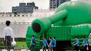 Chinese tourists walk past an inflatable tank man at the Liberty Square of Chiang Kai-shek Memorial Hall in Taipei, Taiwan, Saturday, June 1, 2019. An artist erected the inflatable display in Taiwan’s capital to mark an iconic moment in the Tiananmen Square pro-democracy protests. (AP Photo) Chinese tourists walk past an inflatable tank man at the Liberty Square of Chiang Kai-shek Memorial Hall in Taipei, Taiwan, Saturday, June 1, 2019. An artist erected the inflatable display in Taiwan’s capital to mark an iconic moment in the Tiananmen Square pro-democracy protests. (AP Photo)