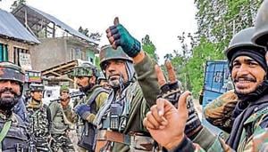 Army soldiers show the victory and thumb up sign near the house where Three top Hizb-ul-Mujahideen militant Commanders including Lateef Tiger (close associate of Burhan Wani) were hiding during an encounter, in which they were killed, at Adkhara Village in Imam Sahab area of South Kashmir’s Shopian district(PTI Photo) Army soldiers show the victory and thumb up sign near the house where Three top Hizb-ul-Mujahideen militant Commanders including Lateef Tiger (close associate of Burhan Wani) were hiding during an encounter, in which they were killed, at Adkhara Village in Imam Sahab area of South Kashmir’s Shopian district(PTI Photo)
