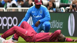 West Indies' Andre Russell gets attention on the side of the pitch during the 2019 Cricket World Cup group stage match between West Indies and Pakistan at Trent Bridge in Nottingham, central England, on May 31, 2019.(AFP) West Indies' Andre Russell gets attention on the side of the pitch during the 2019 Cricket World Cup group stage match between West Indies and Pakistan at Trent Bridge in Nottingham, central England, on May 31, 2019.(AFP)