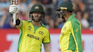 Australia's David Warner celebrates reaching 50 runs next to Australia's Usman Khawaja.(AP) Australia's David Warner celebrates reaching 50 runs next to Australia's Usman Khawaja.(AP)