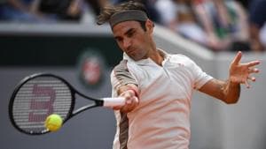 Switzerland's Roger Federer returns the ball to Norway's Casper Ruud during their men's singles third round match on day six of The Roland Garros 2019 French Open tennis tournament in Paris on May 31, 2019. (Photo by Christophe ARCHAMBAULT / AFP)(AFP)