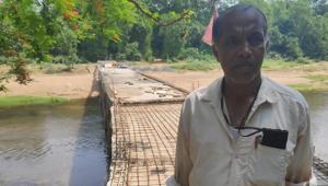For much of his life, the lack of a bridge across the river near his village rankled Gangadhar Rout, a retired livestock inspector.(HT Photo) For much of his life, the lack of a bridge across the river near his village rankled Gangadhar Rout, a retired livestock inspector.(HT Photo)