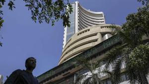 A pedestrian walks past an electronic ticker board indicating latest figures for the S&P BSE Sensex at the Bombay Stock Exchange (BSE) building in Mumbai.(Dhiraj Singh/Bloomberg) A pedestrian walks past an electronic ticker board indicating latest figures for the S&P BSE Sensex at the Bombay Stock Exchange (BSE) building in Mumbai.(Dhiraj Singh/Bloomberg)
