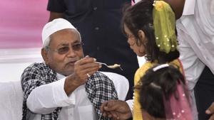 Bihar Chief Minister Nitish Kumar offers sewaiyan (a traditional sweet dish) to children after the Eid-ul-Fitr prayers at Gandhi Maidan in Patna on Wednesday.(PTI) Bihar Chief Minister Nitish Kumar offers sewaiyan (a traditional sweet dish) to children after the Eid-ul-Fitr prayers at Gandhi Maidan in Patna on Wednesday.(PTI)