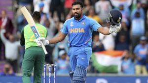India's Rohit Sharma raises his bat and helmet to celebrate scoring a century.(AP) India's Rohit Sharma raises his bat and helmet to celebrate scoring a century.(AP)