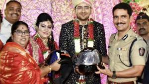 Commissioner of Police Vishwas Nangare Patil gifted helmets to this newlywed couple. Commissioner of Police Vishwas Nangare Patil gifted helmets to this newlywed couple.