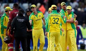 Australia's Nathan Coulter-Nile celebrates with Mitchell Starc and team mates at the end of the match.(Reuters) Australia's Nathan Coulter-Nile celebrates with Mitchell Starc and team mates at the end of the match.(Reuters)