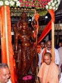 Uttar Pradesh Chief Minister Yogi Adityanath with the newly unveiled seven-foot tall statue of Lord Rama at Ayodhya Shodh Sansthan.(AFP) Uttar Pradesh Chief Minister Yogi Adityanath with the newly unveiled seven-foot tall statue of Lord Rama at Ayodhya Shodh Sansthan.(AFP)