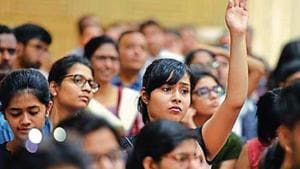 A girl raises her hand to ask a question as students and parents gather during a counselling session with experts on the admission process of Delhi University .(Raj K Raj/ Hindustan Times) A girl raises her hand to ask a question as students and parents gather during a counselling session with experts on the admission process of Delhi University .(Raj K Raj/ Hindustan Times)