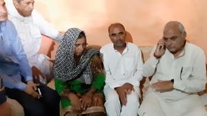 Former Haryana chief minister Bhupinder Singh Hooda with Pankaj Sangwan’s mother (left) and other family members in Sonepat on Tuesday.(HT Photo) Former Haryana chief minister Bhupinder Singh Hooda with Pankaj Sangwan’s mother (left) and other family members in Sonepat on Tuesday.(HT Photo)