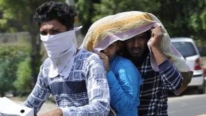 Noida, India - June 10, 2019: Boys on a two-wheeler cover themselves with a cloth to beat the heat on a summer day, in Noida, India, on Monday, June 10, 2019. (Photo by / Hindustan Times)(Sunil Ghosh /HT Photo/Representative Image) Noida, India - June 10, 2019: Boys on a two-wheeler cover themselves with a cloth to beat the heat on a summer day, in Noida, India, on Monday, June 10, 2019. (Photo by / Hindustan Times)(Sunil Ghosh /HT Photo/Representative Image)
