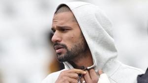 India's Shikhar Dhawan is seen with his left hand covered with a cast during team's training session.(AP)