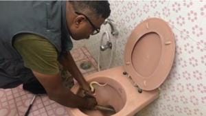 Jayraj trying to fish out the snake with his bare hands.(Screengrab) Jayraj trying to fish out the snake with his bare hands.(Screengrab)