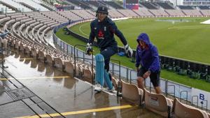 England's Jos Buttler (C) walks off the field as rain falls during a training session.(AFP) England's Jos Buttler (C) walks off the field as rain falls during a training session.(AFP)
