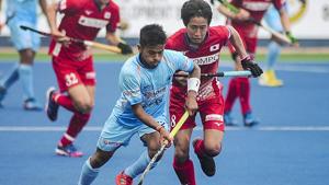 Hockey player Vivek Sagar Prasad vies for ball as India defeats Japan 2-0 in the first match of Sultan Azlan Shah Cup.(PTI) Hockey player Vivek Sagar Prasad vies for ball as India defeats Japan 2-0 in the first match of Sultan Azlan Shah Cup.(PTI)