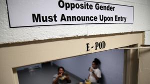 The image shows one of the signs over the doorways within the dedicated unit for transgender migrants in the Cibola County Correctional Center in Milan.(AP File Photo) The image shows one of the signs over the doorways within the dedicated unit for transgender migrants in the Cibola County Correctional Center in Milan.(AP File Photo)