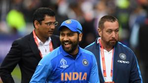 India's Rohit Sharma (C) smiles after receiving the man of the match award(AFP) India's Rohit Sharma (C) smiles after receiving the man of the match award(AFP)