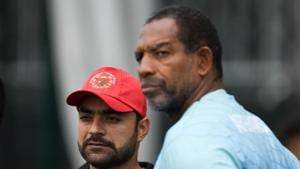 Afghanistan's Rashid Khan (L) and Afghanistan's head coach Phil Simmons (R) attend a training session.(AFP) Afghanistan's Rashid Khan (L) and Afghanistan's head coach Phil Simmons (R) attend a training session.(AFP)