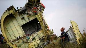 An investigator inspects the crash site of flight MH17, near the village of Hrabove in Donetsk, Ukraine on July 22, 2014. REUTERS/Maxim Zmeyev/File Photo An investigator inspects the crash site of flight MH17, near the village of Hrabove in Donetsk, Ukraine on July 22, 2014. REUTERS/Maxim Zmeyev/File Photo