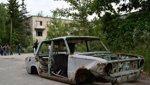 A picture taken on June 7, 2019, shows the wreckage of a car in the ghost city of Pripyat in the Chernobyl exclusion zone on June 7, 2019.(AFP) A picture taken on June 7, 2019, shows the wreckage of a car in the ghost city of Pripyat in the Chernobyl exclusion zone on June 7, 2019.(AFP)