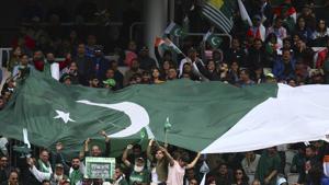 Pakistani fans cheer during the Cricket World Cup match between India and Pakistan.(AP) Pakistani fans cheer during the Cricket World Cup match between India and Pakistan.(AP)