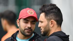 Afghanistan's Rashid Khan (L) talks with Afghanistan's captain Gulbadin Naib (R) during a training session.(AFP) Afghanistan's Rashid Khan (L) talks with Afghanistan's captain Gulbadin Naib (R) during a training session.(AFP)