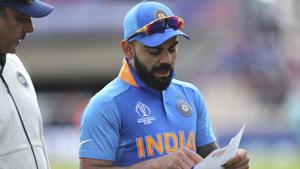 India's captain Virat Kohli, right, talks to team coach Ravi Shastri as he reads from the team sheet before the start of the Cricket World Cup match between India and Afghanistan at the Hampshire Bowl in Southampton(AP) India's captain Virat Kohli, right, talks to team coach Ravi Shastri as he reads from the team sheet before the start of the Cricket World Cup match between India and Afghanistan at the Hampshire Bowl in Southampton(AP)