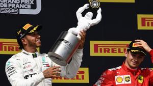 Mercedes' British driver Lewis Hamilton (L) celebrates with his trophy.(AFP) Mercedes' British driver Lewis Hamilton (L) celebrates with his trophy.(AFP)