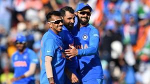 India's captain Virat Kohli (R) celebrates with teammates Mohammed Shami (C) and Yuzvendra Chahal (L) after the dismissal of Afghanistan's Mohammad Nabi during the 2019 Cricket World Cup group stage match between India and Afghanistan at the Rose Bowl in Southampton, southern England, on June 22, 2019(AFP) India's captain Virat Kohli (R) celebrates with teammates Mohammed Shami (C) and Yuzvendra Chahal (L) after the dismissal of Afghanistan's Mohammad Nabi during the 2019 Cricket World Cup group stage match between India and Afghanistan at the Rose Bowl in Southampton, southern England, on June 22, 2019(AFP)