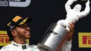 Winner Mercedes' British driver Lewis Hamilton (L) celebrates with his trophy on the podium next to third placed Ferrari's Monegasque driver Charles Leclerc after the Formula One Grand Prix de France at the Circuit Paul Ricard in Le Castellet, southern France, on June 23, 2019. (Photo by Boris HORVAT / AFP)(AFP) Winner Mercedes' British driver Lewis Hamilton (L) celebrates with his trophy on the podium next to third placed Ferrari's Monegasque driver Charles Leclerc after the Formula One Grand Prix de France at the Circuit Paul Ricard in Le Castellet, southern France, on June 23, 2019. (Photo by Boris HORVAT / AFP)(AFP)