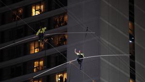 Aerialists Nik Wallenda, right, and his sister Lijana walk on a high wire above Times Square.(AP) Aerialists Nik Wallenda, right, and his sister Lijana walk on a high wire above Times Square.(AP)