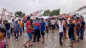 People gather at the site in Barmer’s Jasol where a tent collapsed during a storm on June 23, 2019.(PTI) People gather at the site in Barmer’s Jasol where a tent collapsed during a storm on June 23, 2019.(PTI)