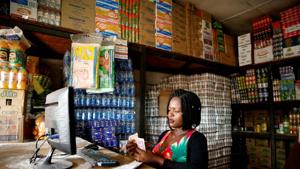 A woman counts cash as her shop opens in Harare, Zimbabwe. REUTERS/Philimon Bulawayo/File Photo A woman counts cash as her shop opens in Harare, Zimbabwe. REUTERS/Philimon Bulawayo/File Photo