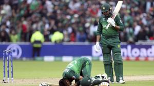 Pakistan's batsman Babar Azam, left, bows down as teammate Haris Sohail watches on after scoring a century during the Cricket World Cup(AP) Pakistan's batsman Babar Azam, left, bows down as teammate Haris Sohail watches on after scoring a century during the Cricket World Cup(AP)
