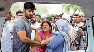 Relatives of Congress leader Vikas Chaudhary mourn his death in Faridabad on Thursday. (Subhash Sharma/HT Photo) Relatives of Congress leader Vikas Chaudhary mourn his death in Faridabad on Thursday. (Subhash Sharma/HT Photo)